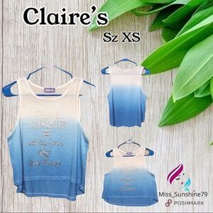Claire’s - S - flowy top proud supporter tan line